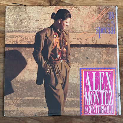 Vintage album cover with a person in a coat on a wooden surface