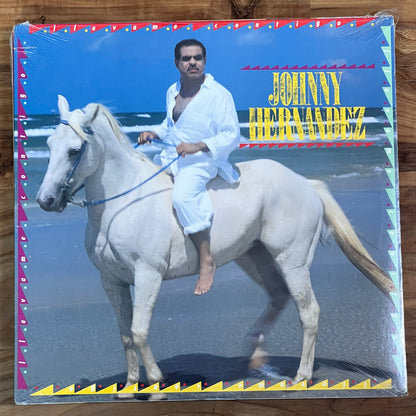 Record album cover with a person and horse on a wooden surface